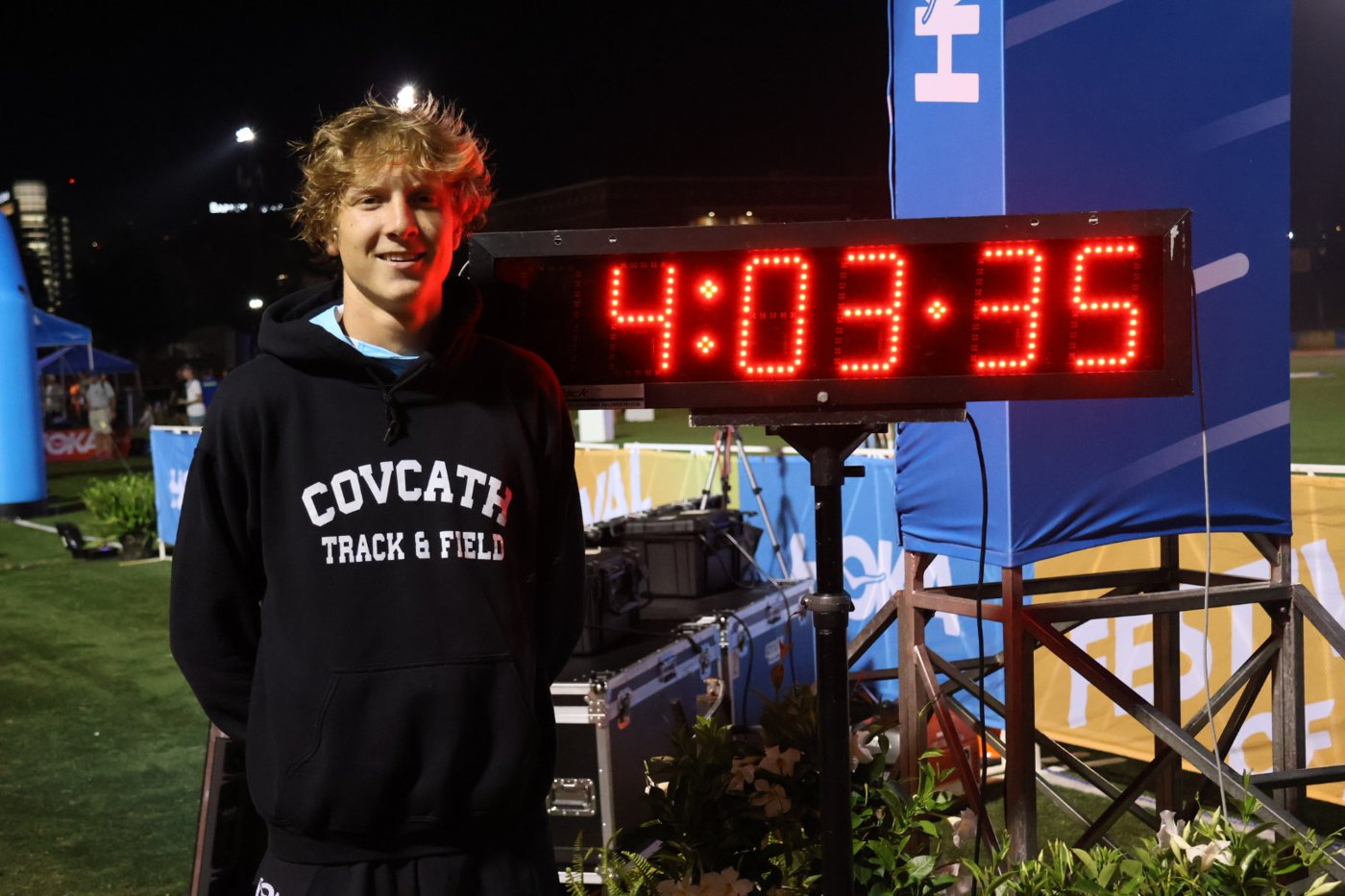William next to a race clock reading 4:03